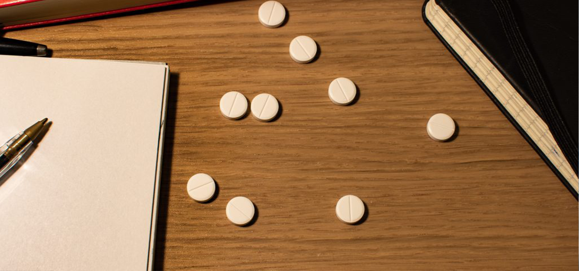 Adderall_College_1 white pills on desk