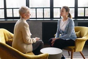 two women talking in womens rehab