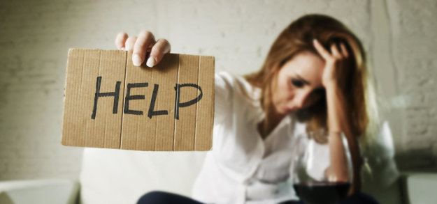 woman holding sign reading Help