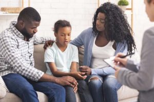 a family talking to their doctor about a loved one in Family Therapy Program