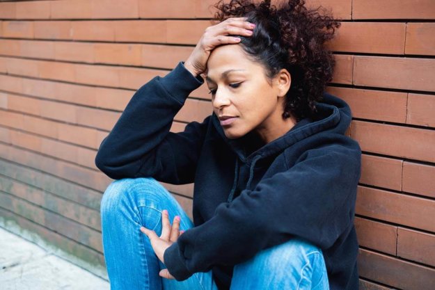 a woman feeling stressed trying to stop addictive behaviors