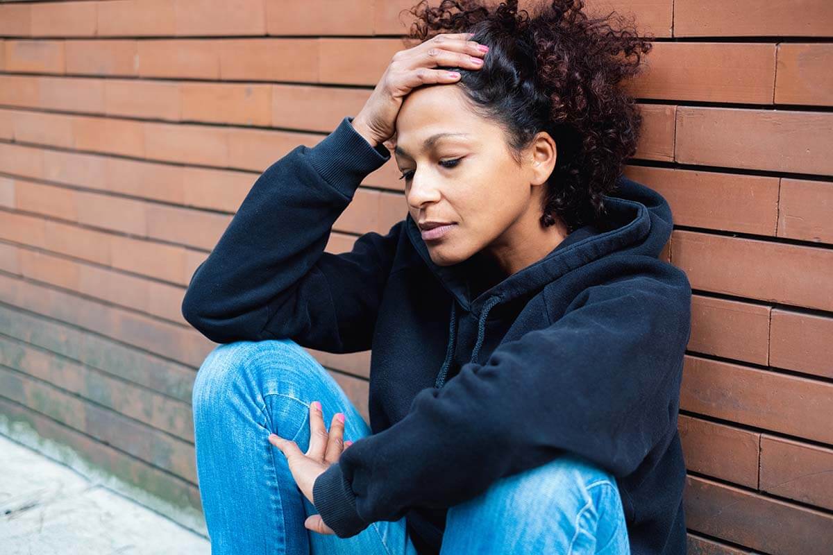 a woman feeling stressed trying to stop addictive behaviors