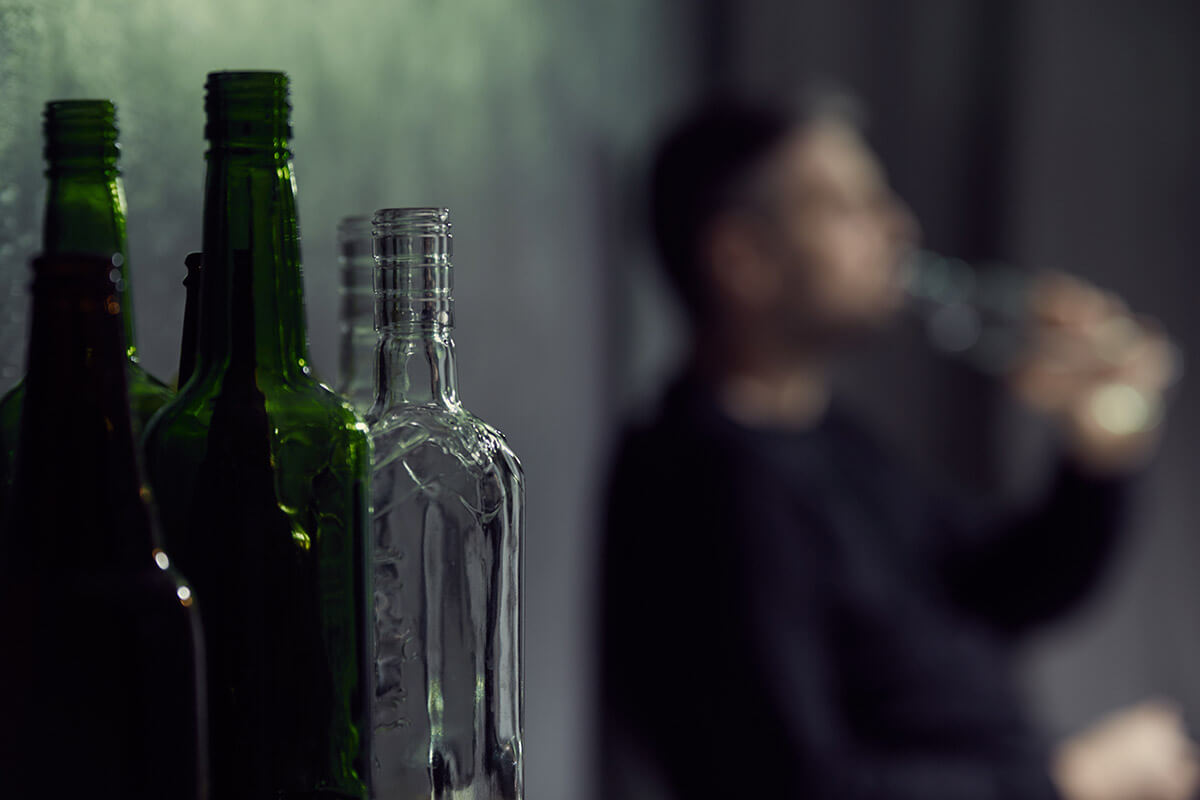 a person drinking unaware of signs of alcohol overdose