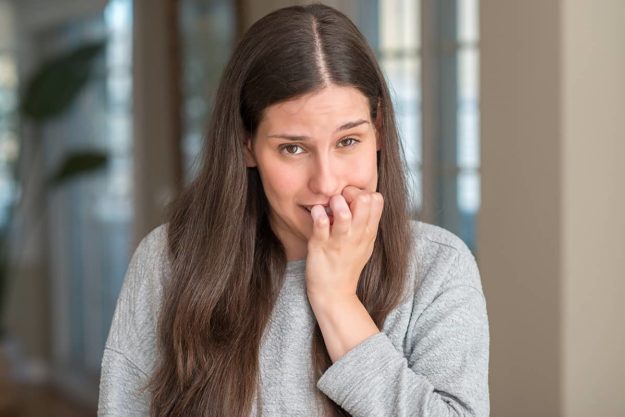 xanax abuse woman biting her nails struggling with xanax abuse